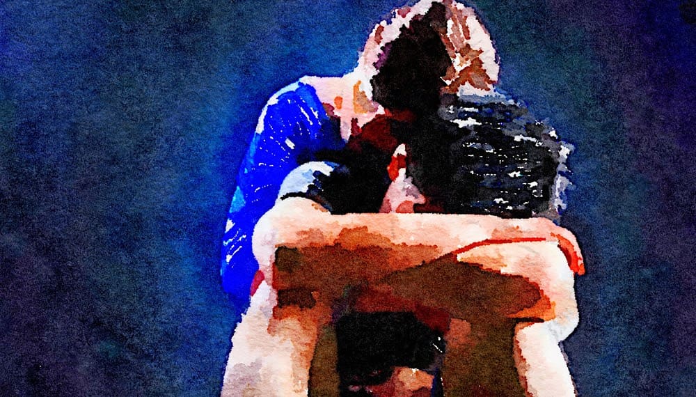 A woman consoles a distressed man